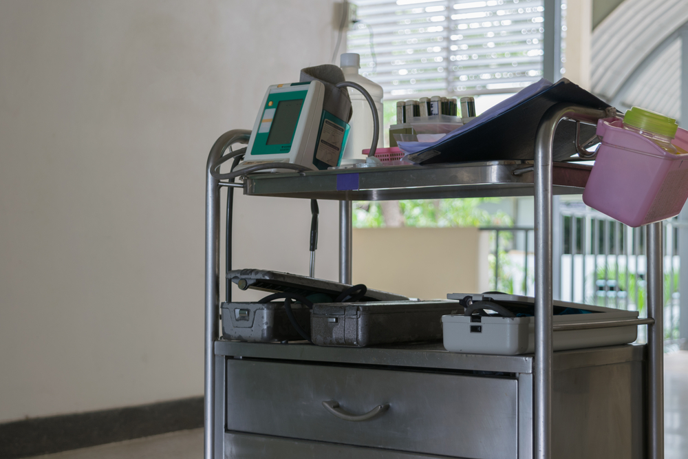 Medical equipment on medical trolley in a hospital room