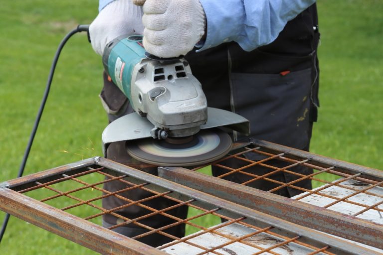 cleaning metal using a flap disc for an angle grinder