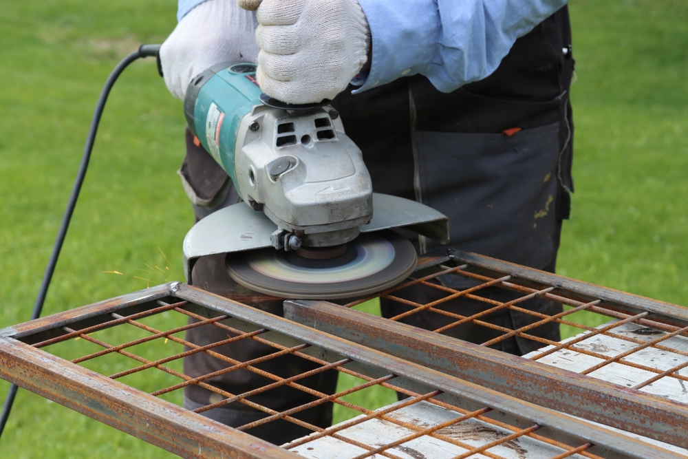 cleaning metal using a flap disc for an angle grinder