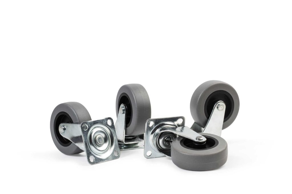 Four heavy-duty swivel caster wheels with grey tread and steel mounting plates on a white background